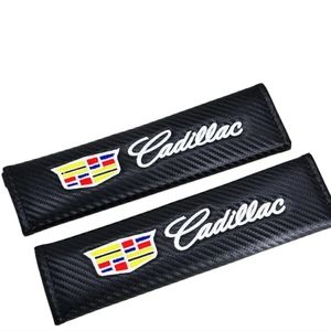 2 new carbon fiber Cadillac seat belt pads